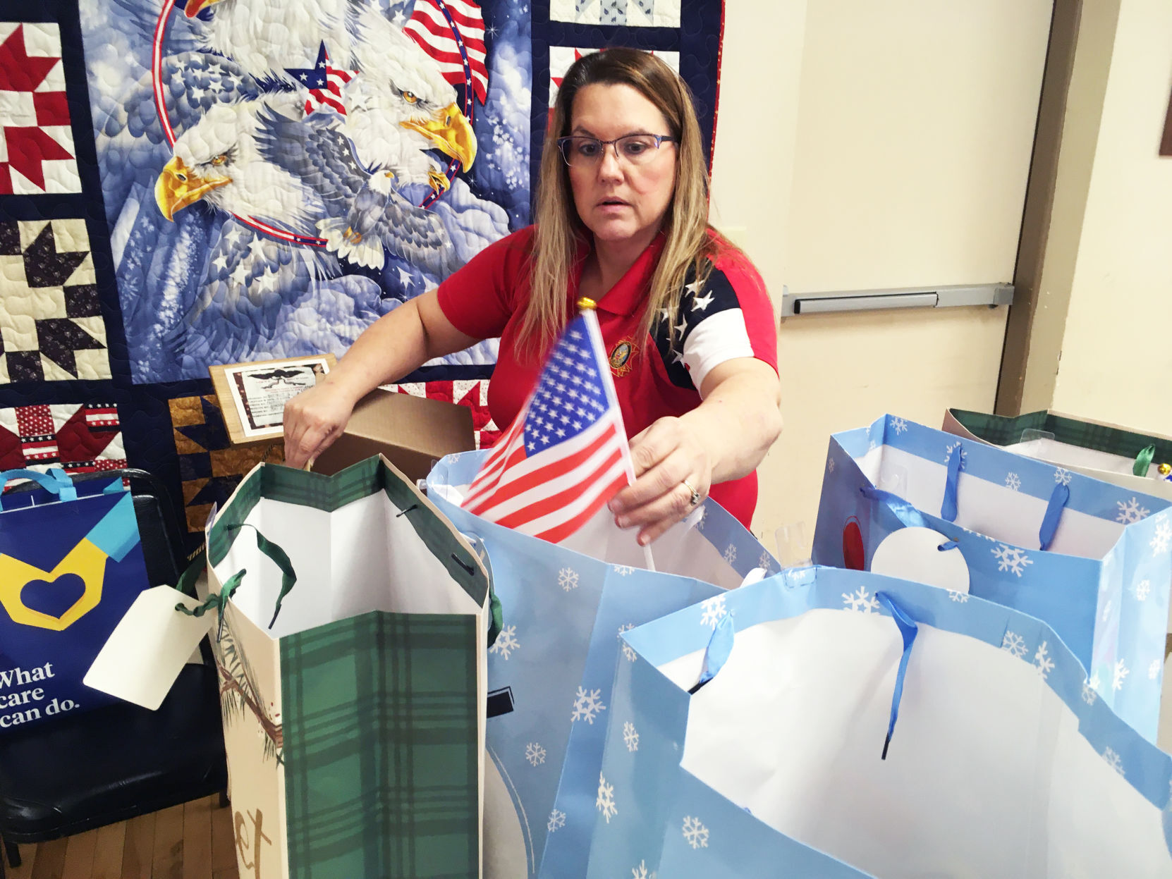 Kim McWilliams adds American flags to gift bags for veterans home residents